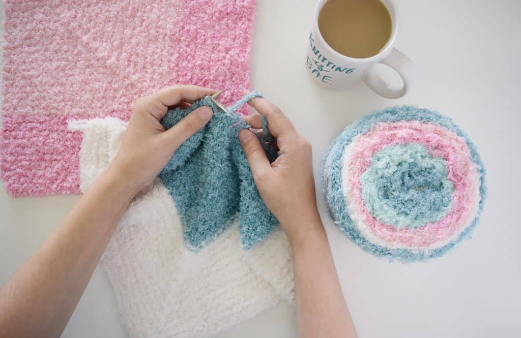 Click for a yarn review of Bernat Pipsqueak Stripes and the Cloud Nine Baby Blanket - a free pattern from Yarnspirations. #knittingpattern #yarnspirations #babyblanket