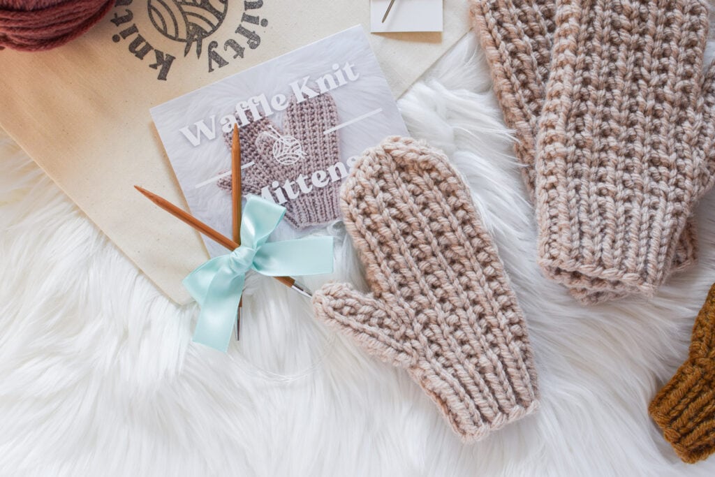 Cozy Waffle Knit Mittens in rich hues, showcasing a textured pattern and crafted with Hue and Me yarn. Ideal winter accessory for warmth and style, available in four sizes from child to adult. Perfect for chilly days and handmade comfort.